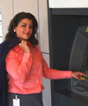 Woman using the bank machine