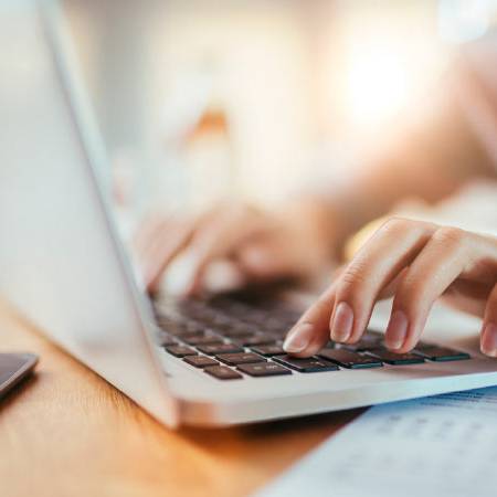 Person typing on a laptop