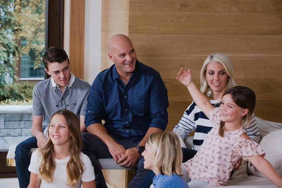 A family having conversation with each other and laughing.