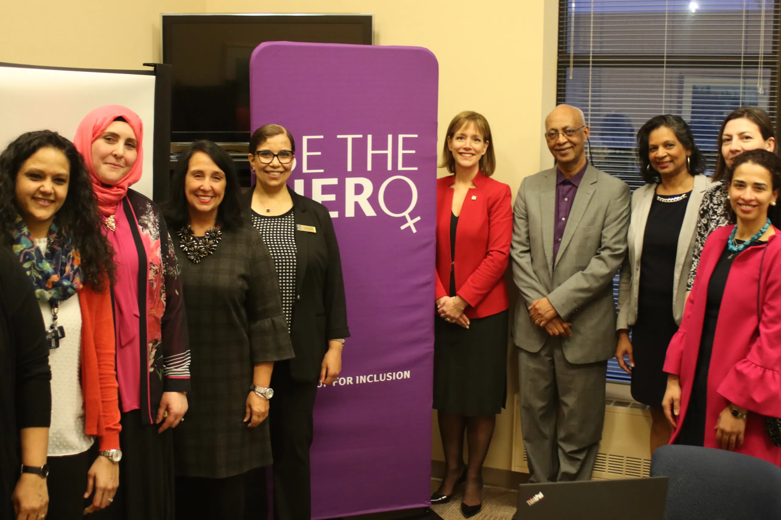 Heidi Hemdan and others standing for a photo to mark International Women