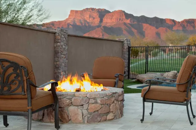 A U.S. vacation home with a fire pit and mountains in the background