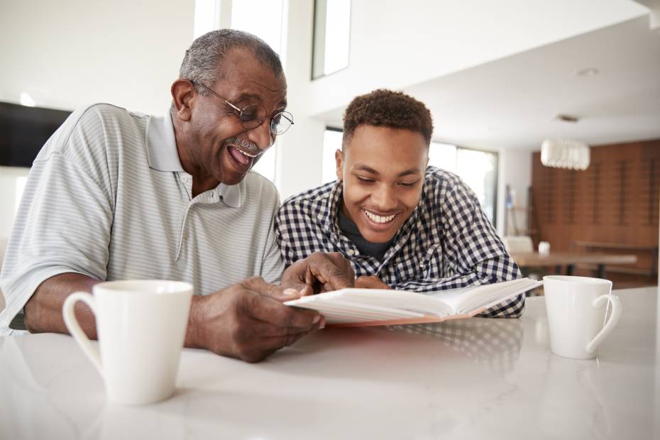 A grandfather helps his grandson prepare to study in the U.S.