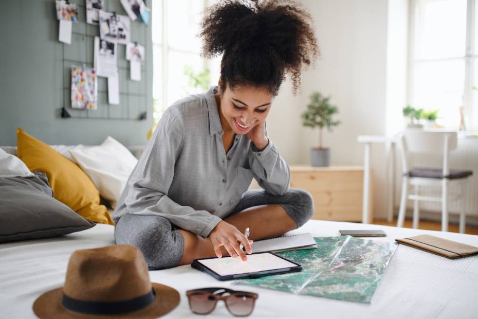 A woman looking at her tablet.