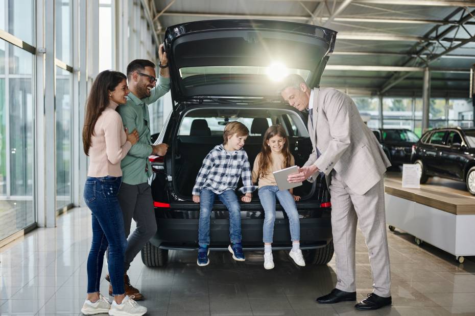 Family buying a car at a dealership