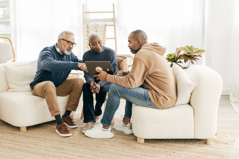 Advisor having a discussion with two clients