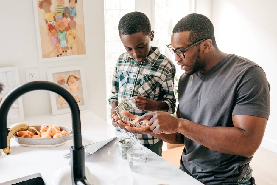 Man teaching his son money management