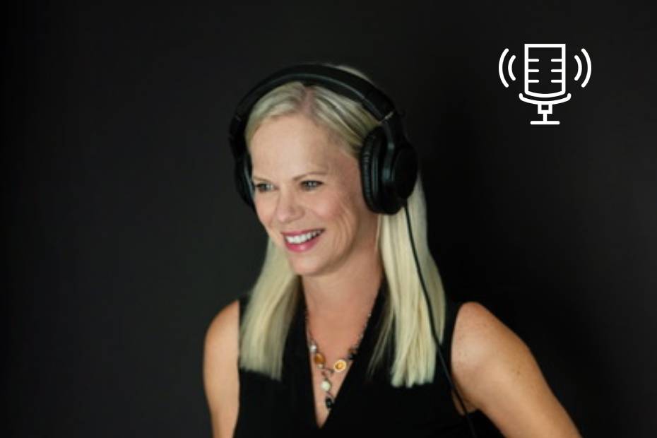 Parenting expert Kathy Buckworth of the Go-To Grandma podcast, smiling and wearing headphones