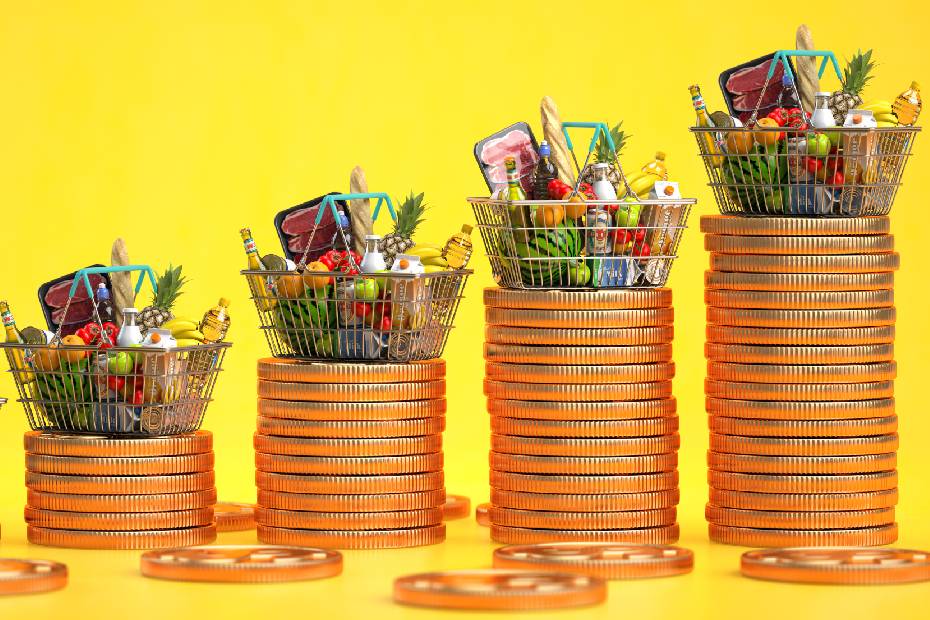 Baskets of food balanced over piles of coins.