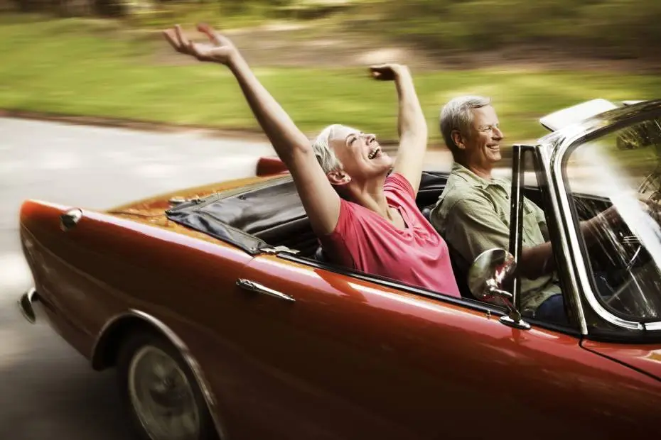 Couple riding in a convertible