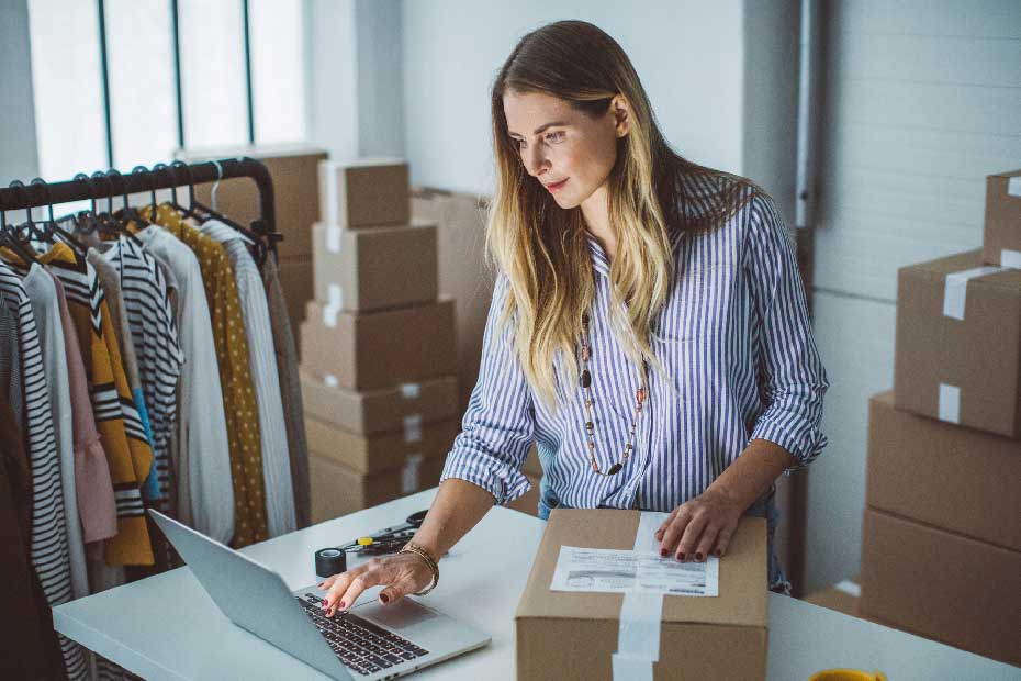 Business Owner working through ideas on her laptop