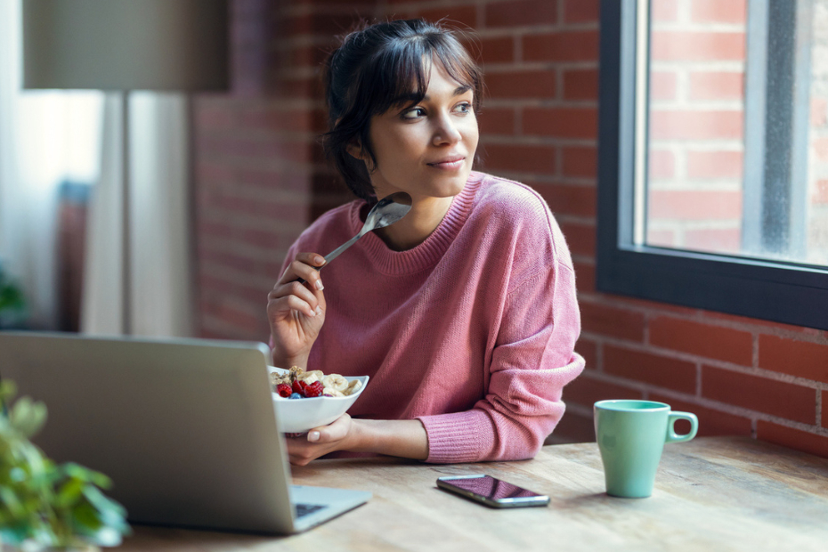 A lady siting in front of a laptop