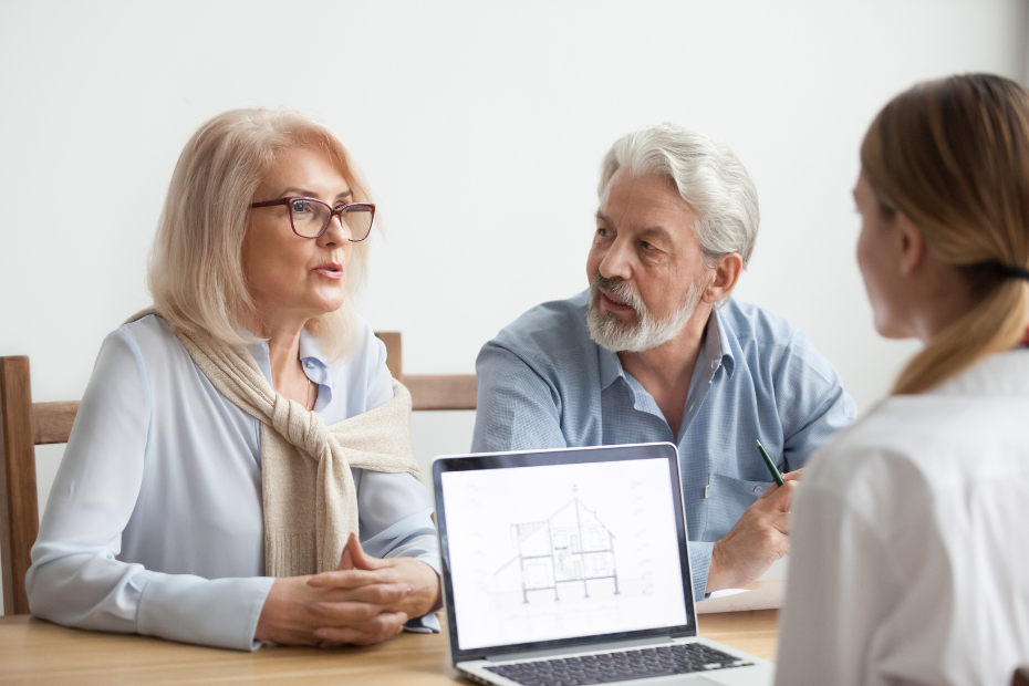 Older couple speaking with an advisor about renovation plans