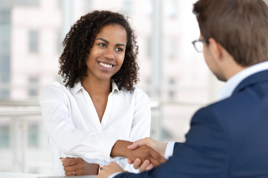 african female shaking hands with HR interviewer