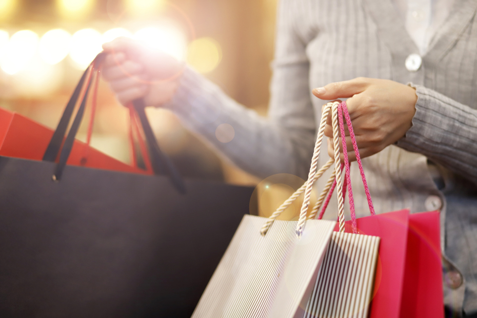 Close up of a woman carrying shopping bags