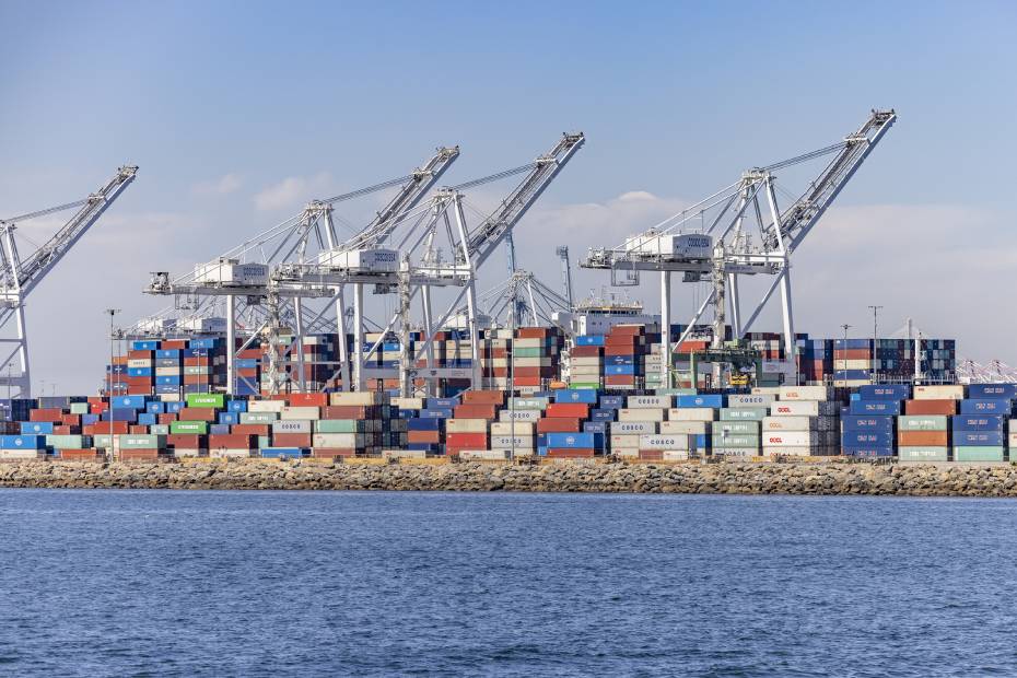 An international port with stacks of shipping containers and cranes