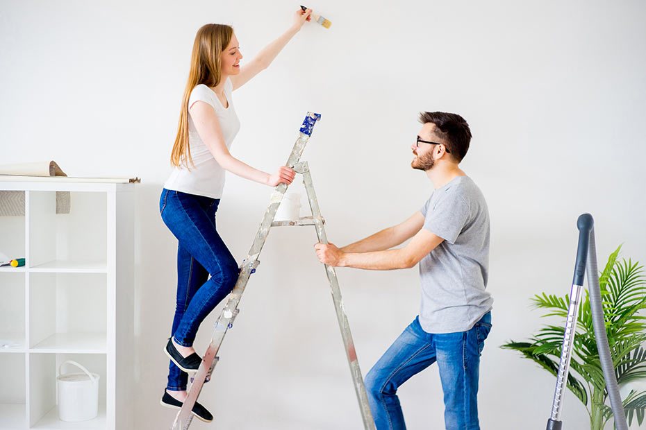 Two people on a step ladder