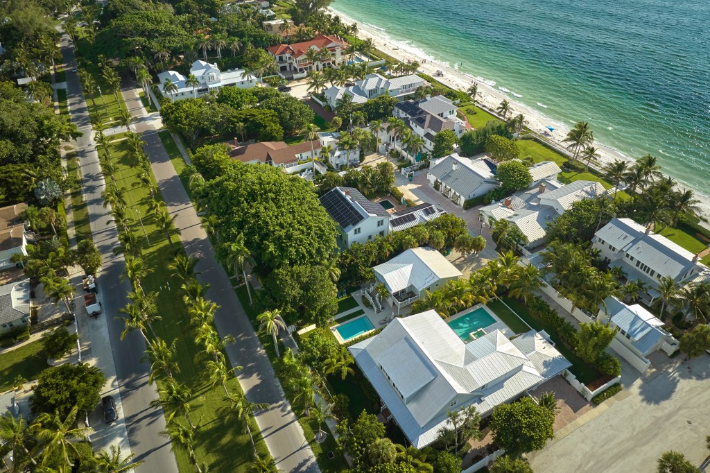 An aerial view of houses by a beach