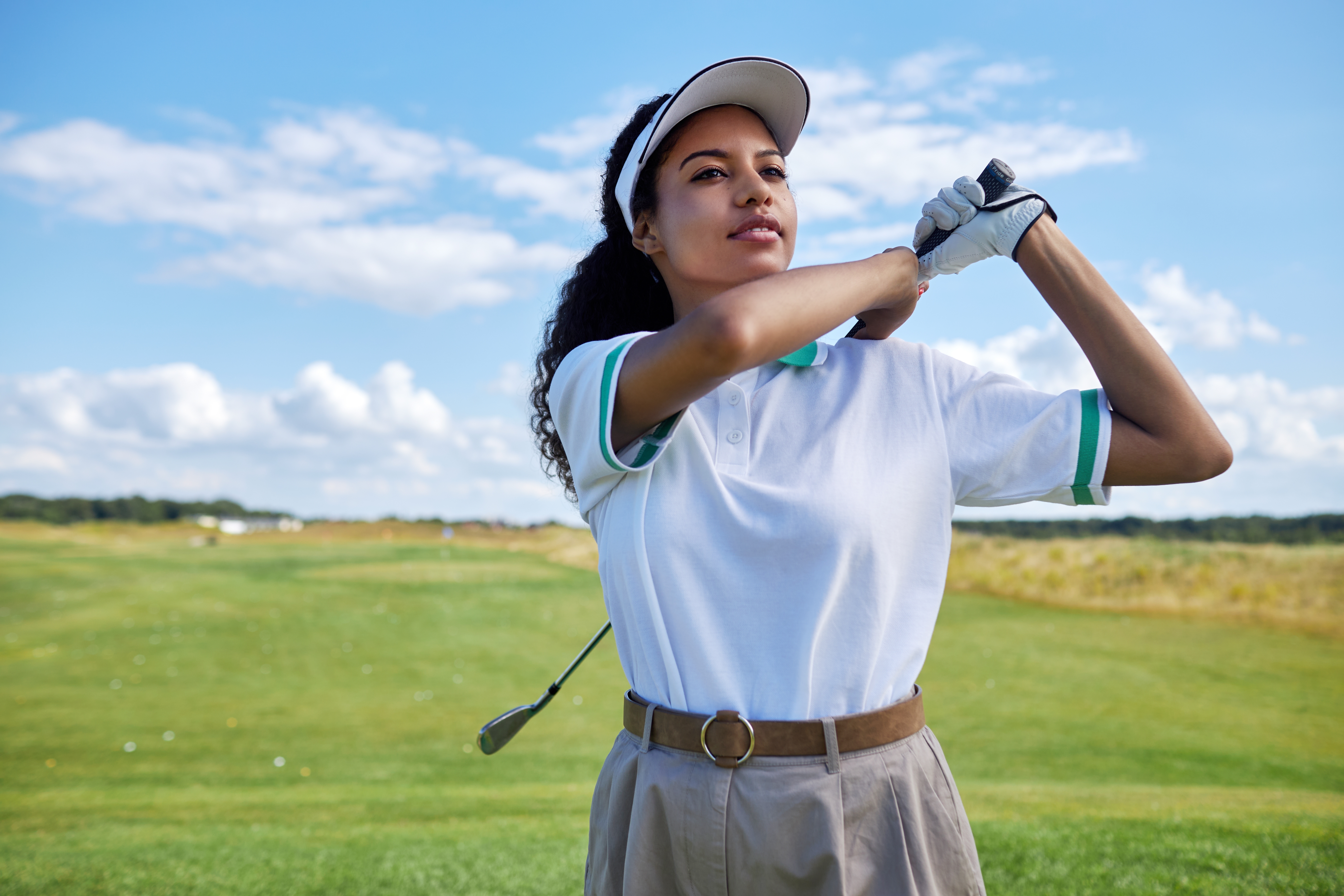 Woman golfing