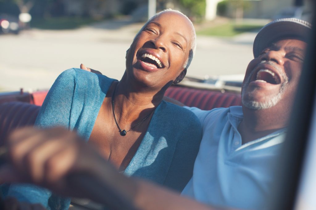 Couple laughing in a car