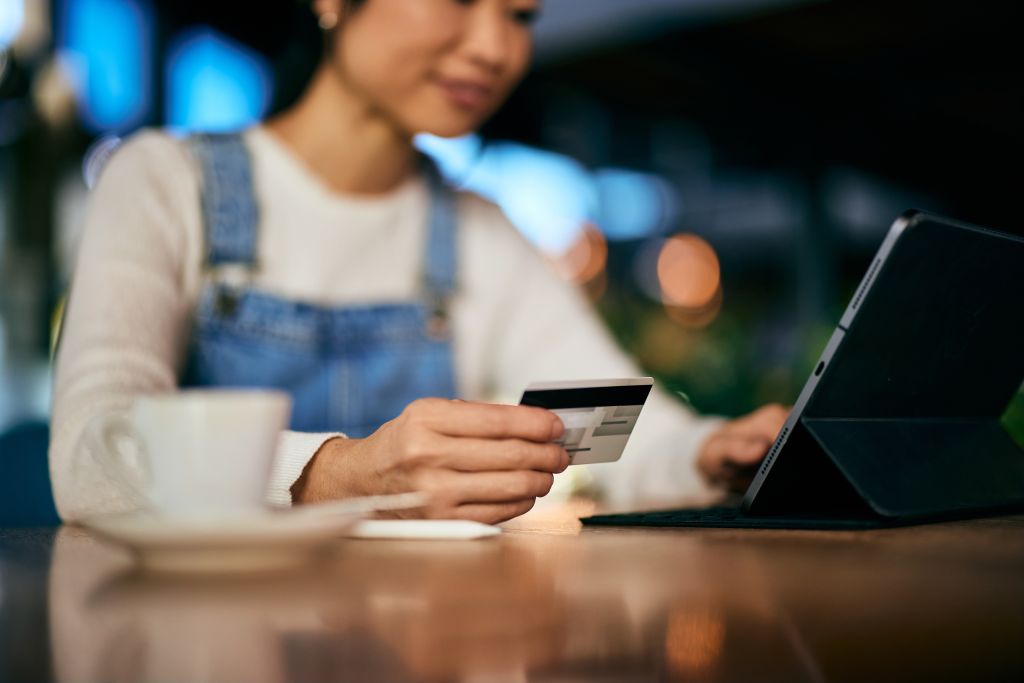 Suggestion is to show a young person using a credit card to make a purchase at a store