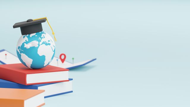 Studying abroad with a graduation cap on a globe