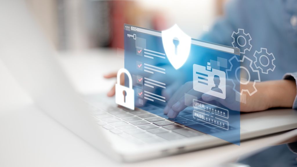 A business owner on their laptop with graphics overlayed to show password and security protection