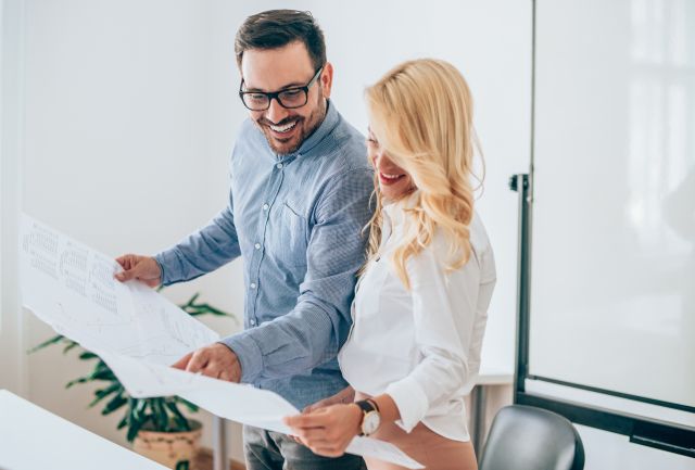 Image of a man and woman reviewing a document