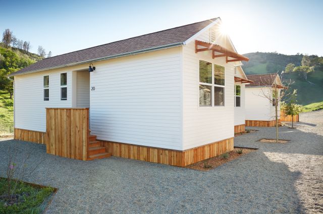 Modular home in a manufactured home community, illustrating a modern factory-built design and affordable residential housing option.