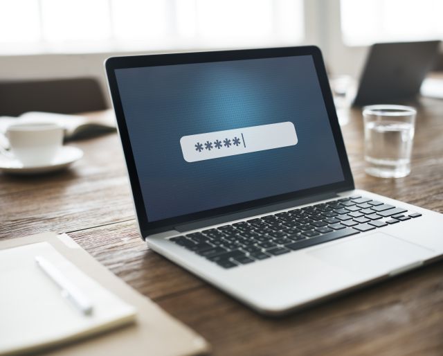 Password being typed on a laptop screen.