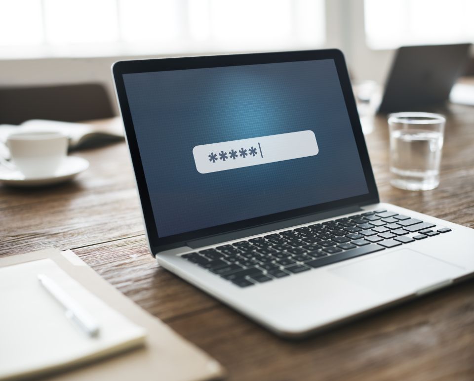 Password being typed on a laptop screen.