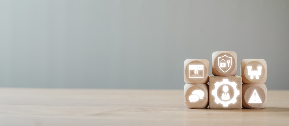 Stacked wooden blocks with glowing icons.