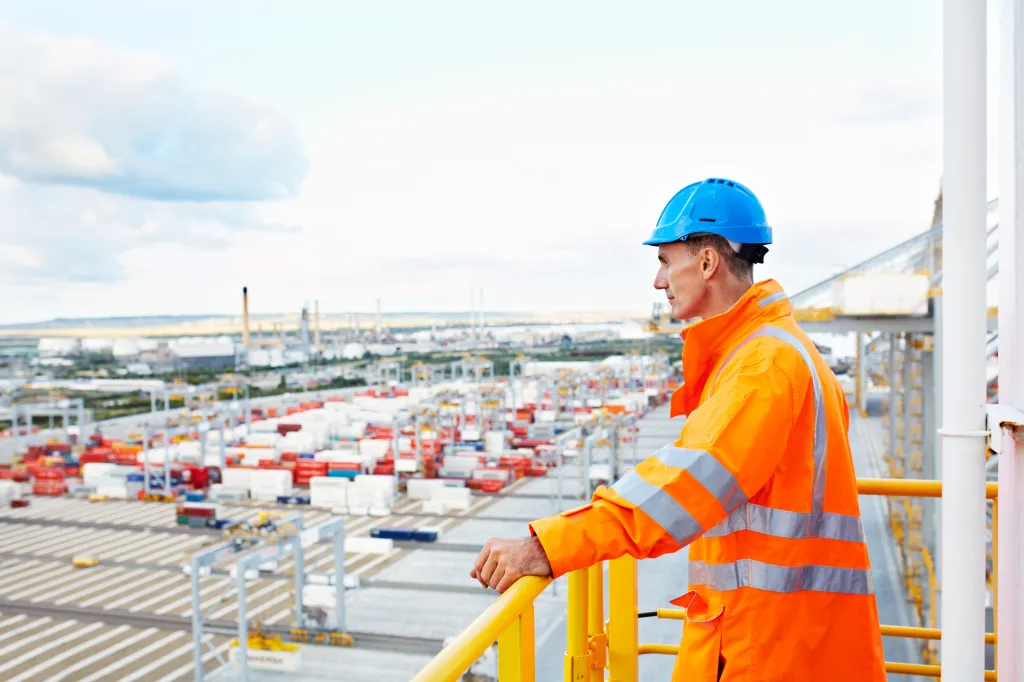 worker overlooking shipping dock
