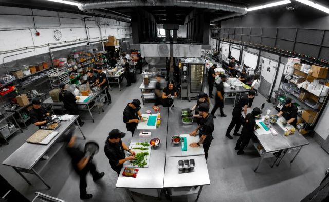 Staff preparing food in The Food Dude's industrial kitchen