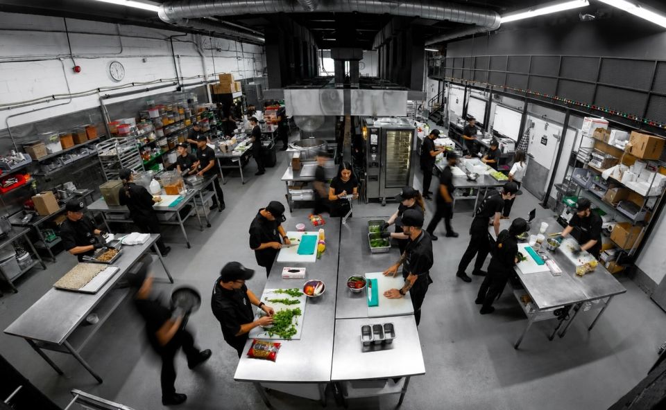 Staff preparing food in The Food Dude's industrial kitchen
