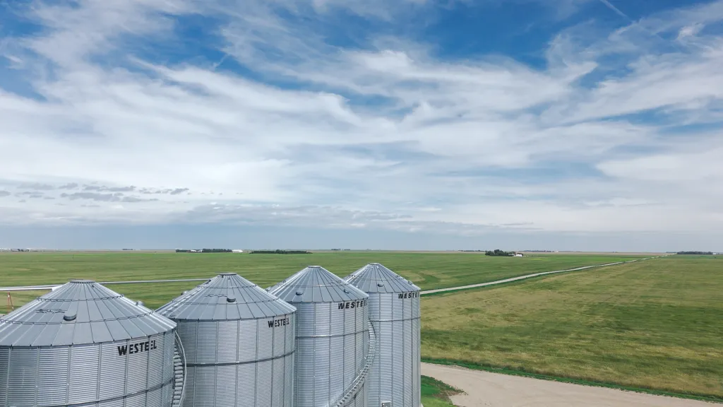 Canadian farm grain storage against blue sky