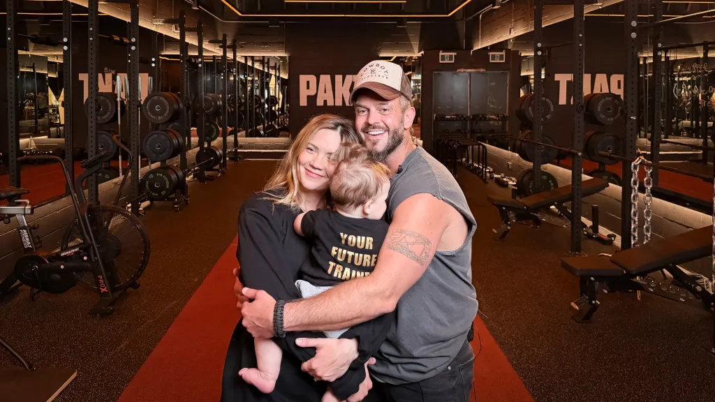 Founders of PAKT Fitness, Chris Lewarne and Karina Vee, smiling in their studio space